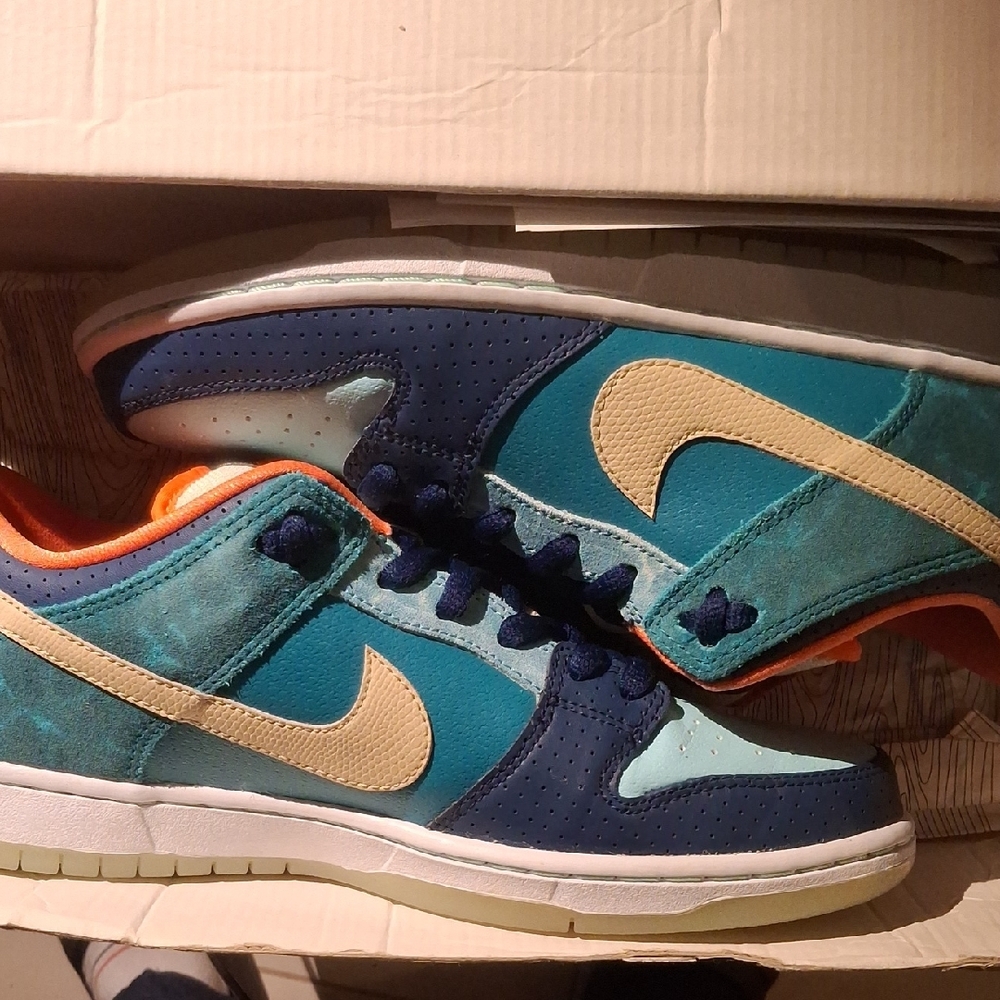 Nike Blue and Teal Sneakers with Orange Accents
